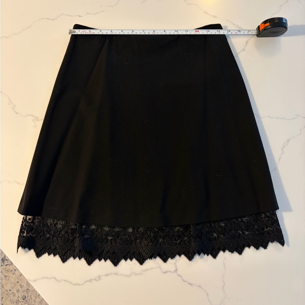 DKNY size 2 Black Skirt with Lace Edge Fully Lined. Like New